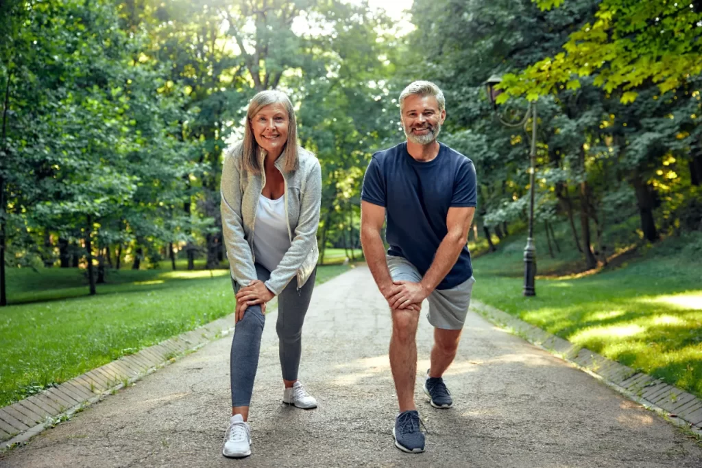 outdoor fitness active seniors engaging in stretch utc